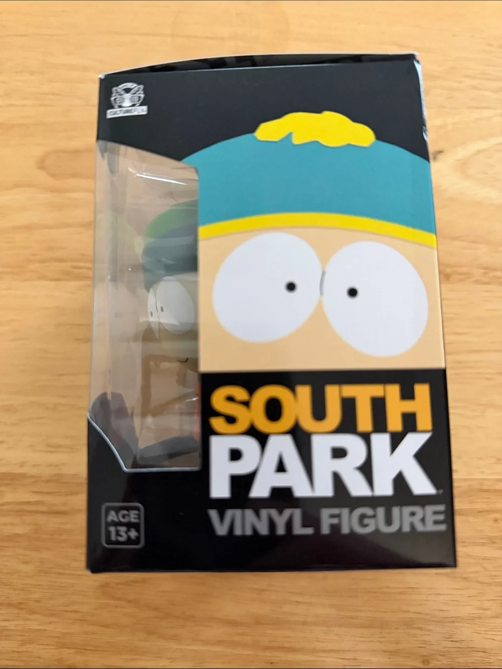 Kyle Vinyl Figure - Green Hat & Orange Jacket